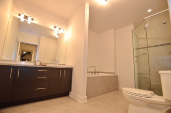 Condo bathroom with two sinks